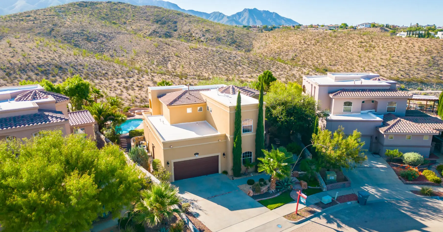 Aerial view of hillside homes with mountain views on the West Side of El Paso
