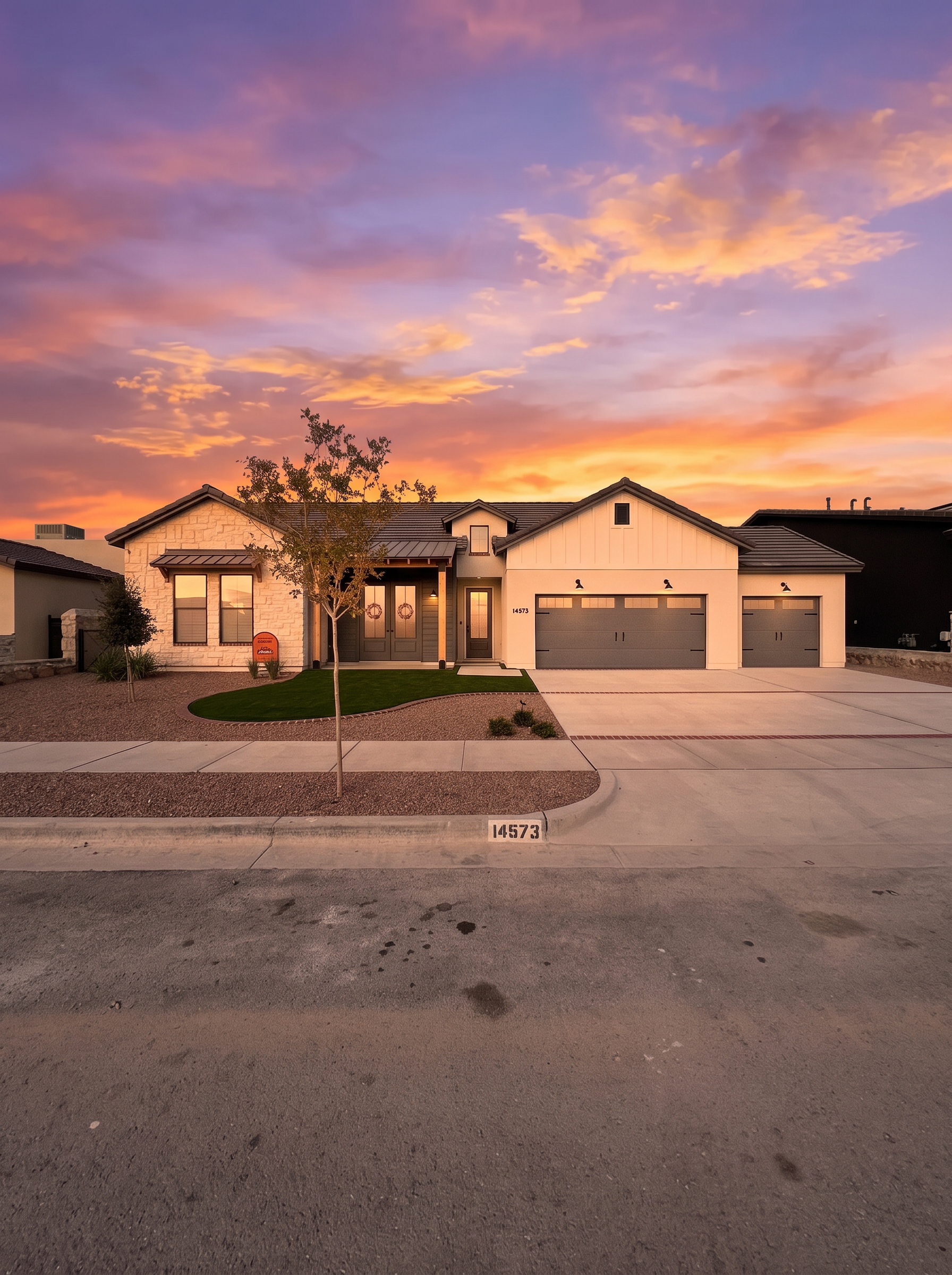 New construction home in El Paso under a sunset sky